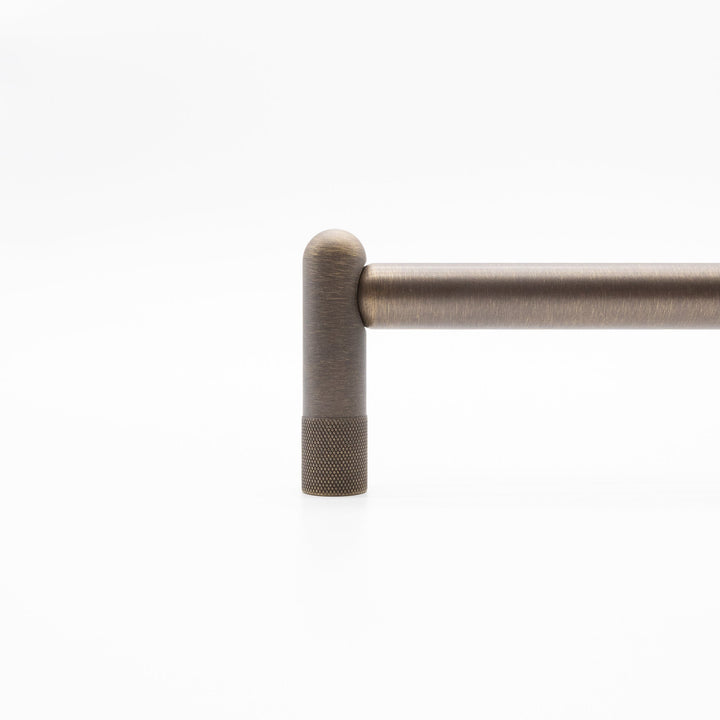 Knurled stem of appliance pull in antique english finish.