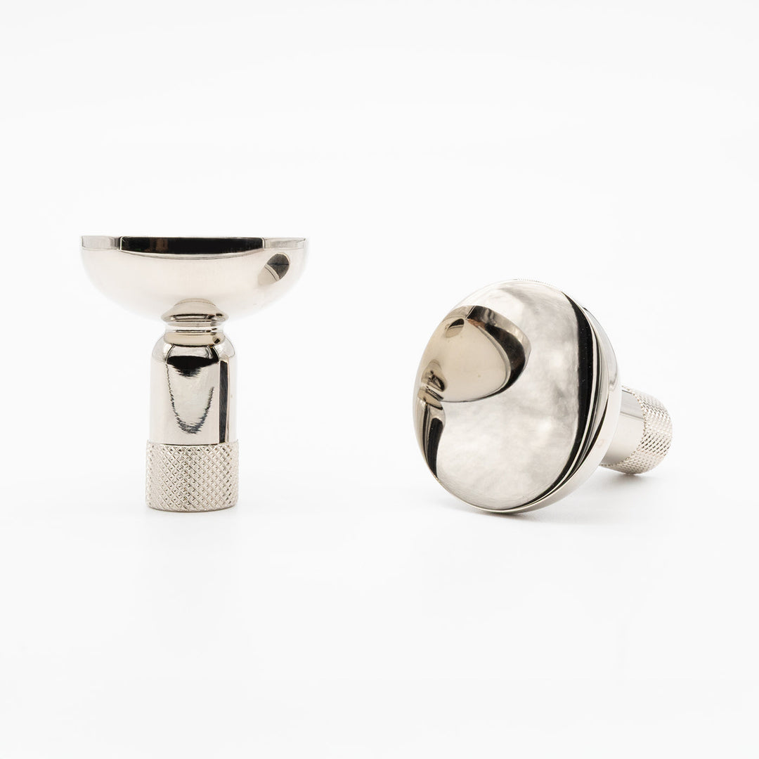 Two Hapny Knurled cabinet knobs in a polished nickel finish, one standing and one angled lying down.