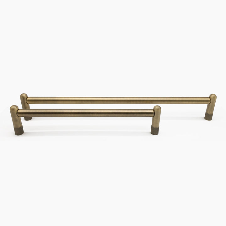 Aged brass appliance handle on a white background