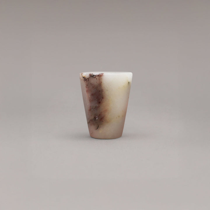 Marbled stone knob on a gray background