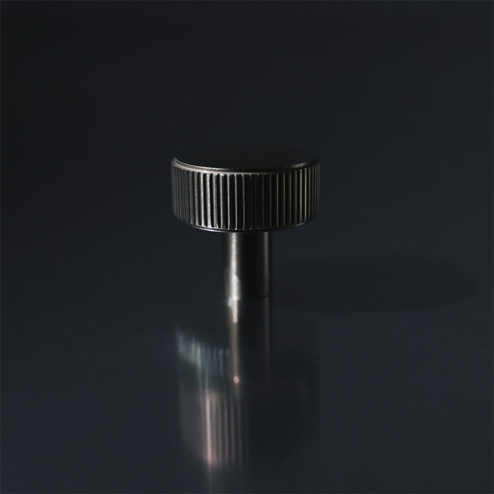 Ribbed Knob on Mirrored Surface.