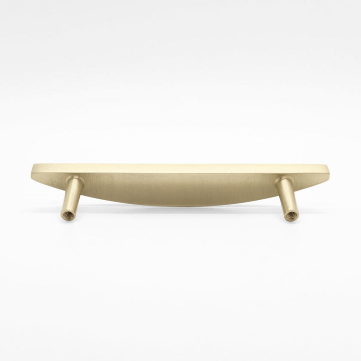 Rear-facing, laying down view of a Half Moon cabinet pull in Satin Brass